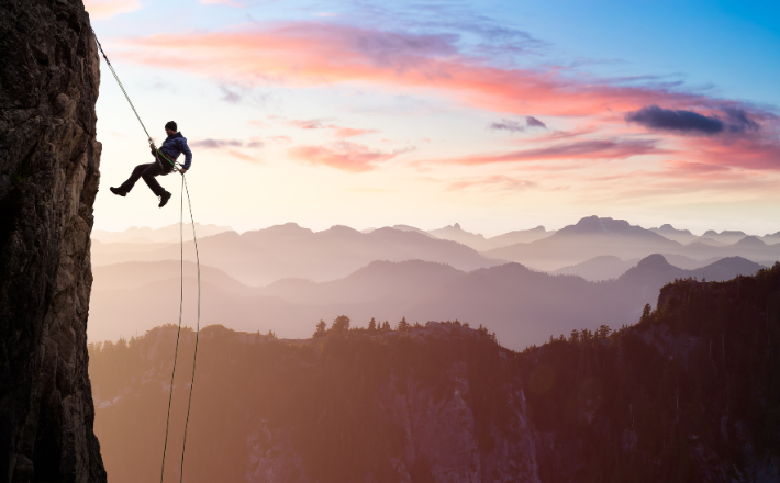 A man hiking up a mountain.