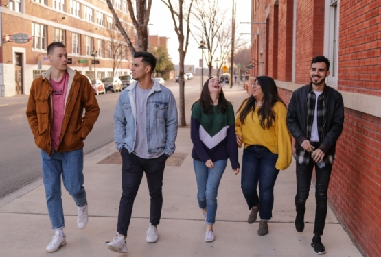 Teens landing page link image showing a group of teens walking down the street