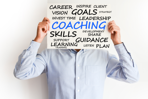 man holding sign in front of face with career words on sign