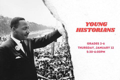 Photo of Martin Luther King Jr. waving to a crowd.