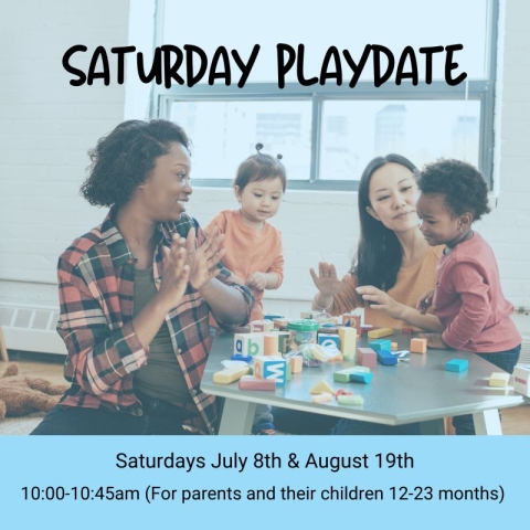 Photo of two mothers playing with toys with their children at a table.