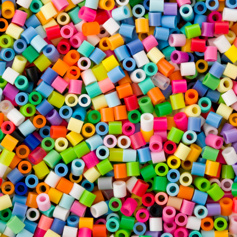 Colorful Perler Bead pieces.