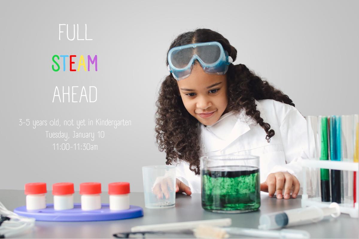 Photo of a young girl with brown hair conducting a science experiment.