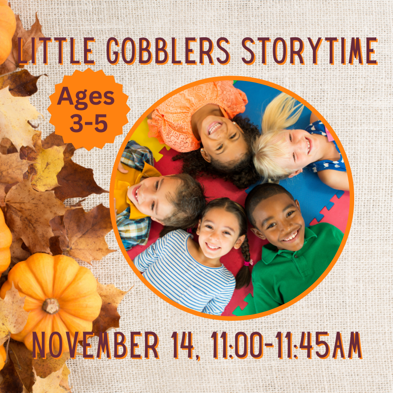 5 children laying down on the ground, forming a circle with their heads.