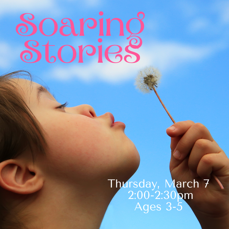 A child blowing on a dandelion.