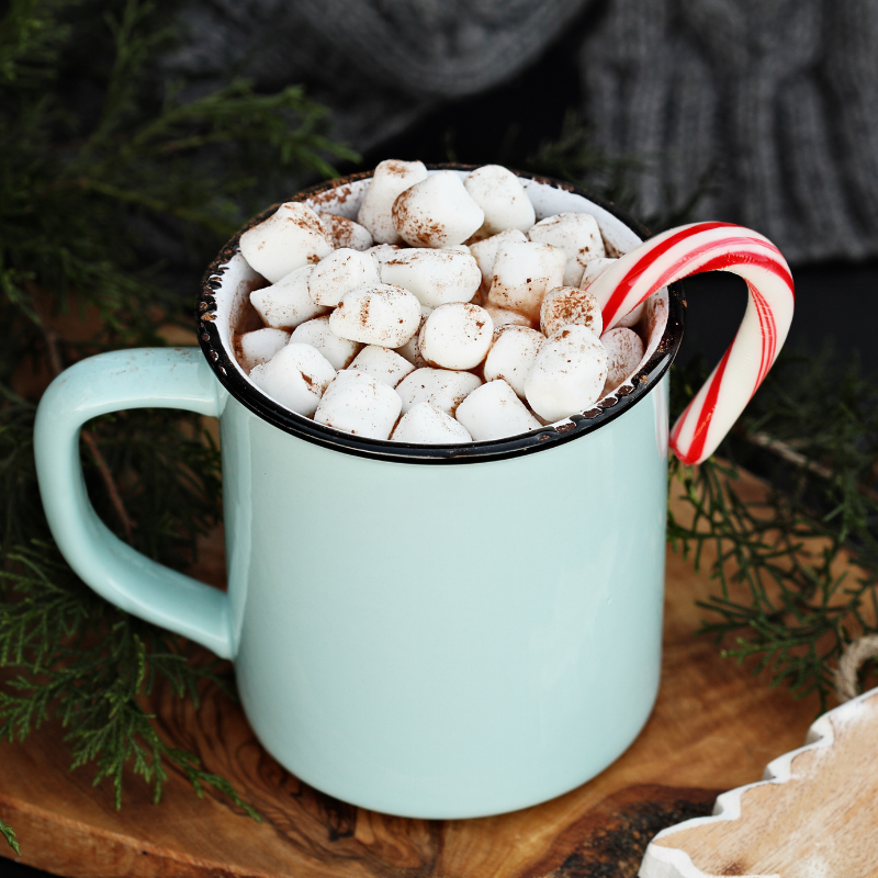 Hot cocoa in a bright blue mug.