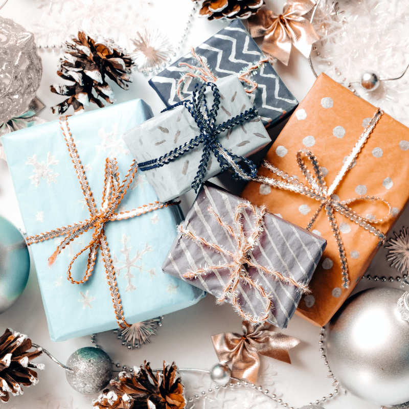 Wrapped presents of a variety of sizes and colors.